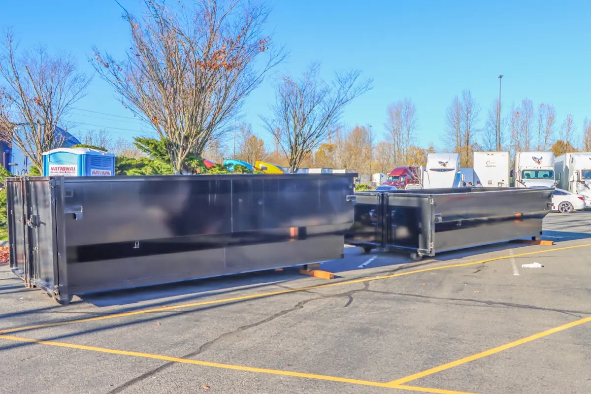 Professional dumpster rental service with roll-off container on residential driveway in LaSalle